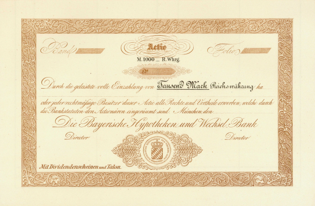 Alte Aktienurkunde mit goldenem Rand, die ein Porträt eines Mannes und Text zeigt, wahrscheinlich eine Anleihe.