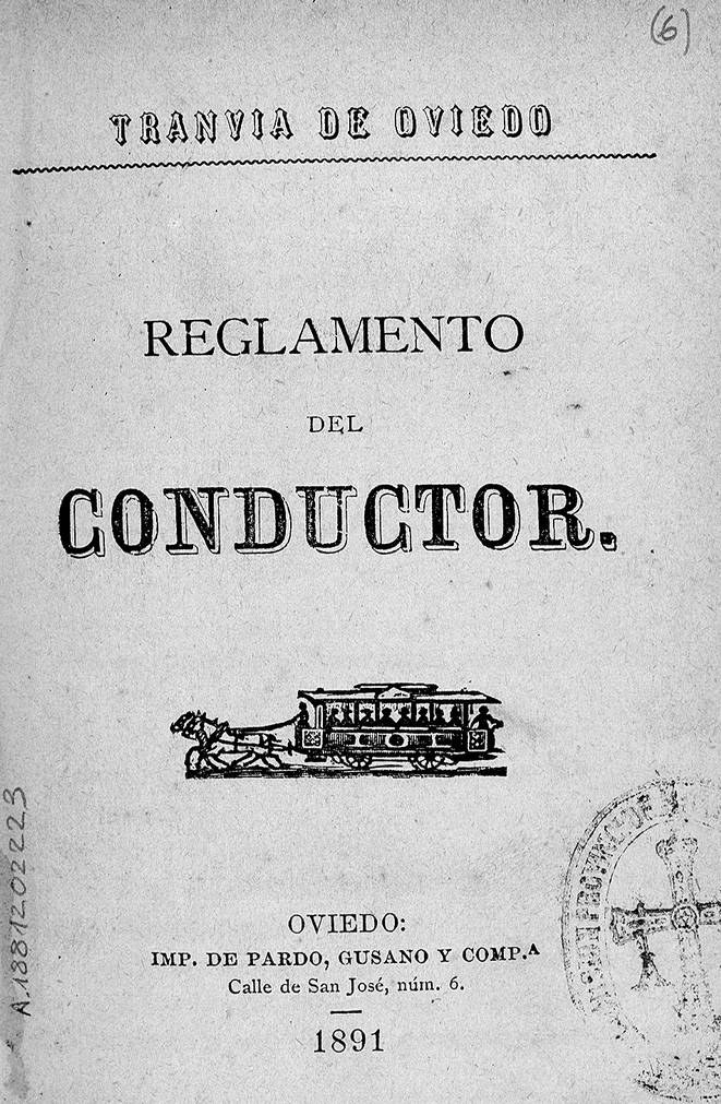 Umschlag eines alten Buches mit dem Titel "Reglamento de Conductor", das eine Zugillustration enthält, mit einem Stempel auf der rechten Seite.